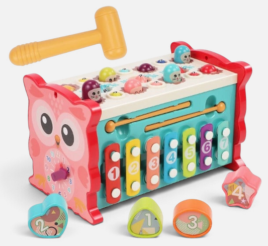 Petit Éveil Montessori sensory toy shaped like an owl, featuring a xylophone, a mallet, and colorful shape sorters.