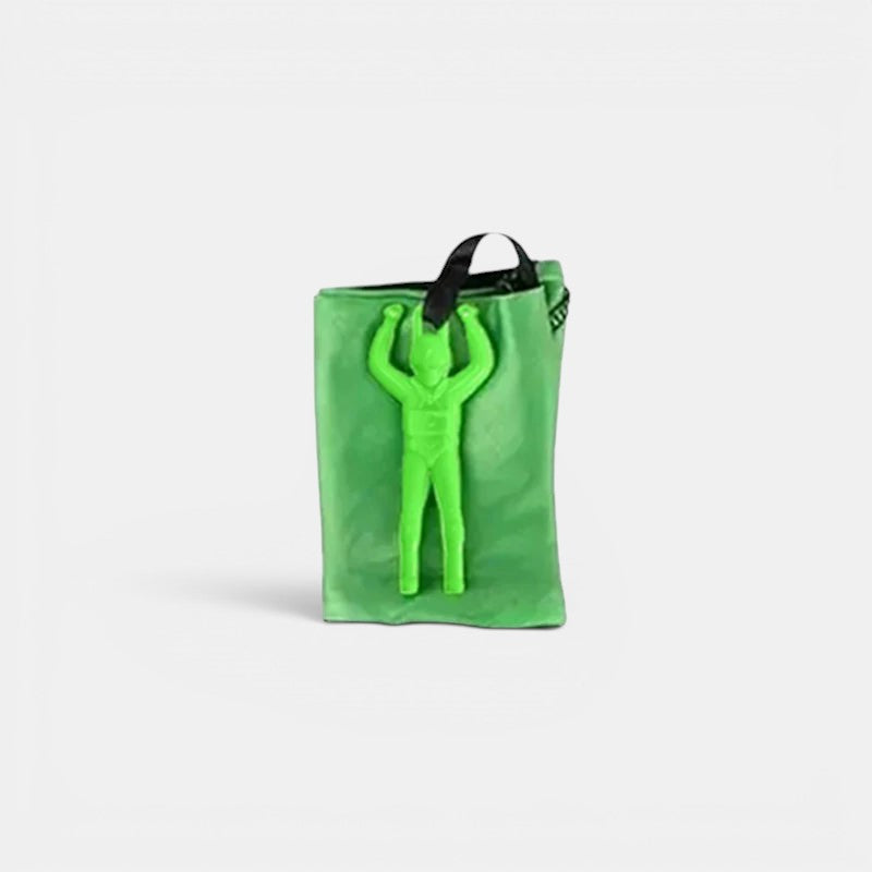 Petit Éveil Montessori - Jouet parachute vert vif avec figurine d'astronaute pour enfants, jeu d'extérieur stimulant la coordination.