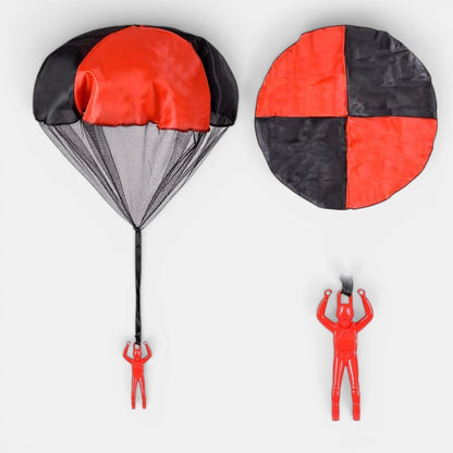 Petit Éveil Montessori, parachute rouge et noir avec figurines pour jeu d'extérieur, développement moteur et imagination.