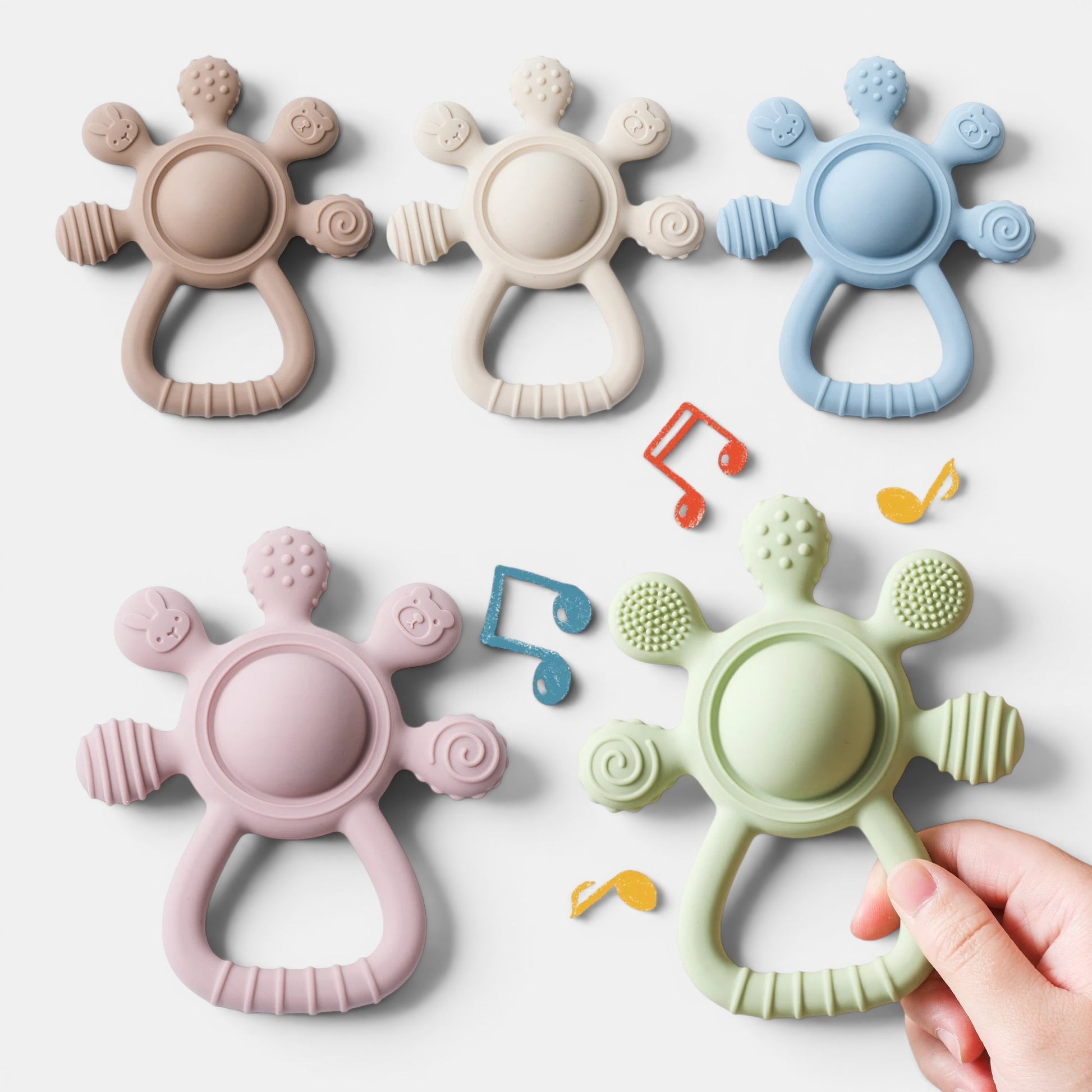 Anneau de dentition Montessori en silicone sans BPA, disponible en rose, vert, bleu, beige et taupe. Jouet sensoriel pour bébé.