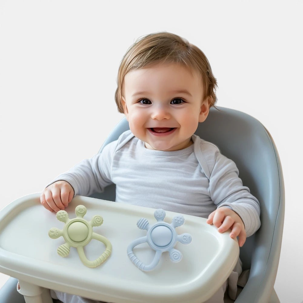 Petit Éveil Montessori : anneau de dentition en silicone sans BPA, vert et bleu, pour bébé, apaisant et stimulant.