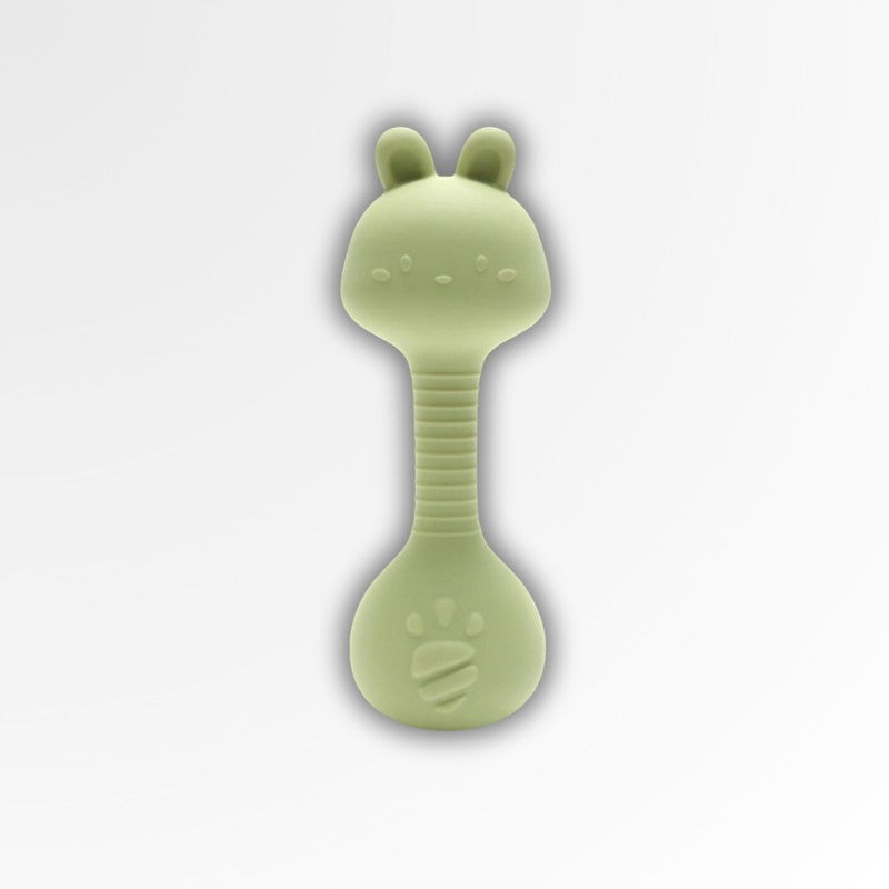 Anneau de dentition hochet Petit Éveil Montessori en silicone vert pâle, forme de lapin, pour apaiser les gencives et stimuler bébé.