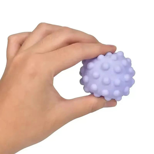 Petit Éveil Montessori : lot de balles sensorielles texturées pour bébé, couleurs vives, idéales pour l'éveil tactile et la motricité.