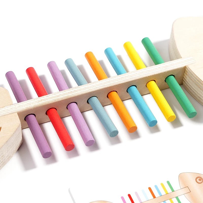 Bâton d'équilibre en bois Petit Éveil Montessori multicolore pour l'éveil sensoriel et la motricité.