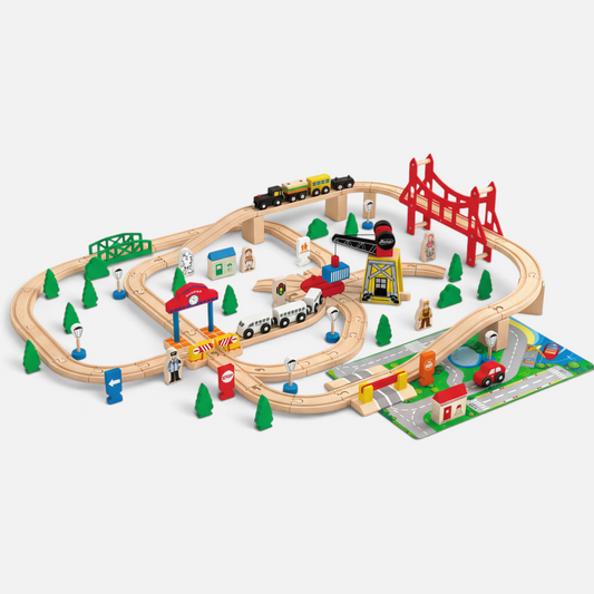 Petit Éveil Montessori Large Wooden Train Set with tracks, bridges, a train station, a crane, vehicles, and city accessories.