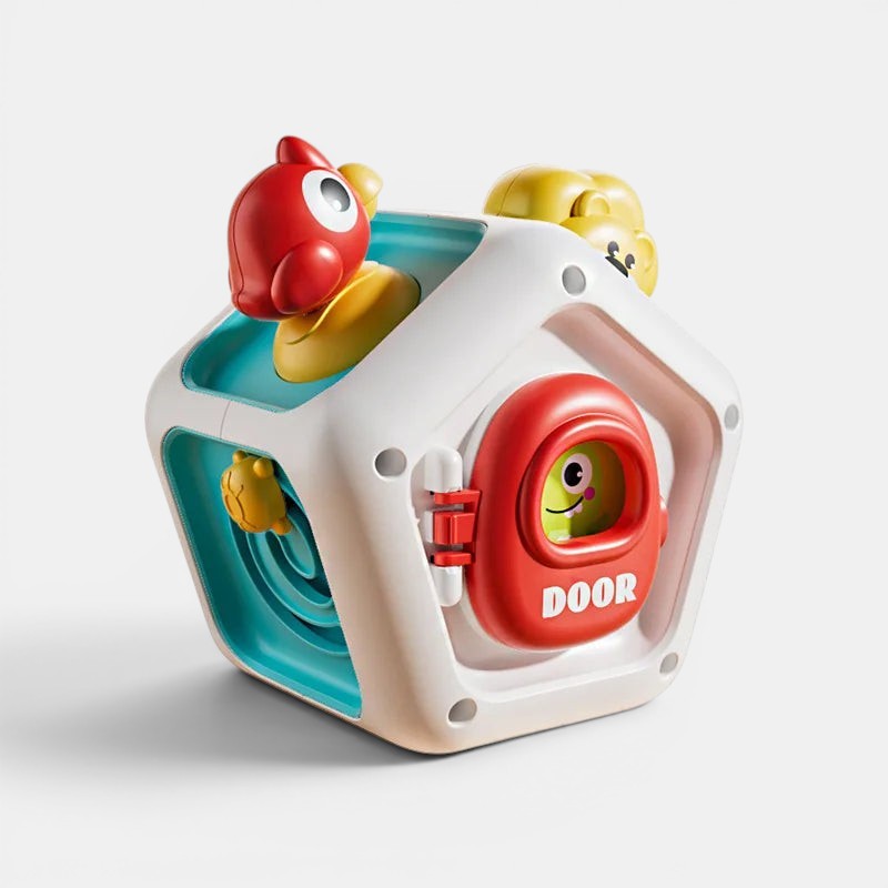 Cube d'activités Montessori Petit Éveil Montessori avec porte rouge, oiseau rouge et jaune, et visage souriant.
