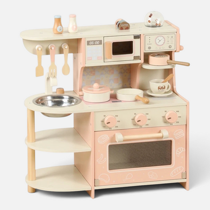 Petit Éveil Montessori Wooden Kitchen Set in Pink and Cream, featuring an oven, microwave, sink, and play accessories.