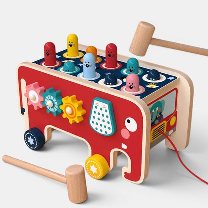 Jeu en bois Petit Éveil Montessori, éléphant rouge avec engrenages, marteaux et personnages à marteler. Idéal pour motricité.