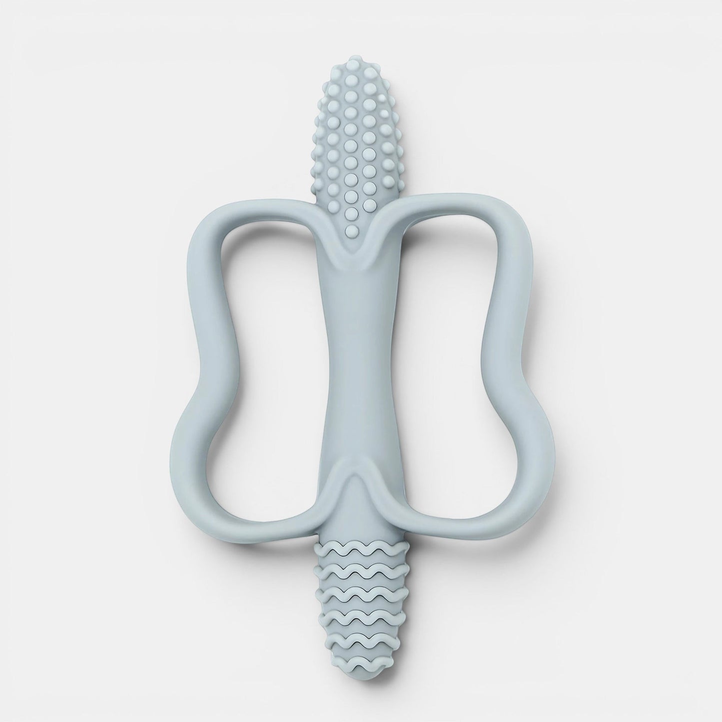 Jouet de dentition Montessori bleu pâle en silicone, forme ergonomique pour bébé, texturé pour soulager les gencives.