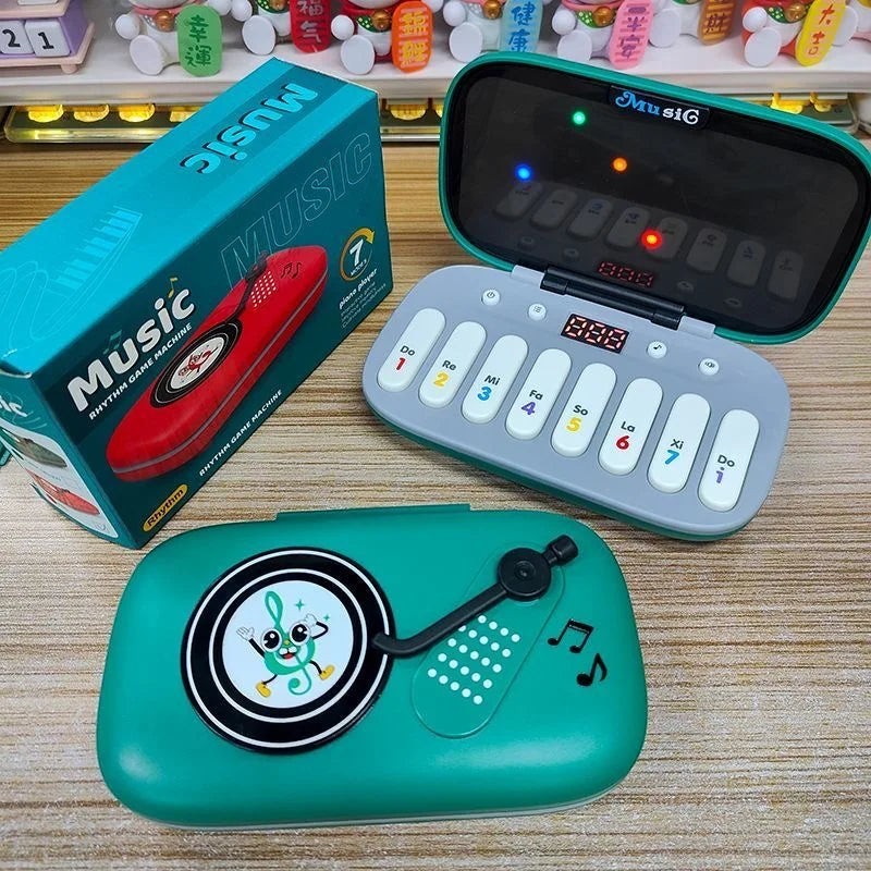 Petit Éveil Montessori : Jouet musical éducatif avec clavier, écran LED et design de tourne-disque, idéal pour l'éveil des tout-petits.