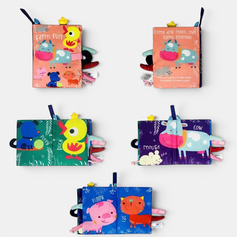 Livre d'activités en tissu Petit Éveil Montessori avec des animaux de la ferme colorés pour bébés.