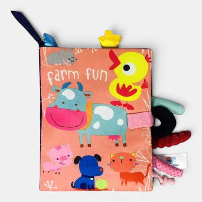 Livre d'éveil en tissu Petit Éveil Montessori avec ferme, vache, canard, chat, chien, cochon et souris.