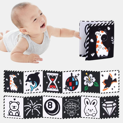Livre sensoriel en tissu noir et blanc Petit Éveil Montessori avec des illustrations de girafe, dauphin, sablier, boule disco, fleur, oiseau, ours, lapin et diamant.