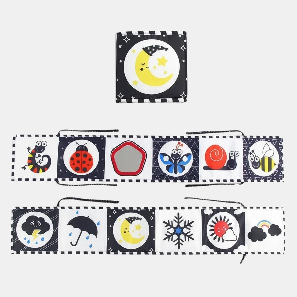 Livre sensoriel en tissu Petit Éveil Montessori avec des illustrations noir et blanc et couleurs vives : lune, papillon, coccinelle, abeille, météo.