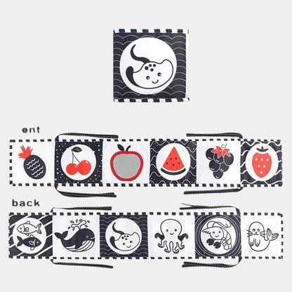 Livre sensoriel Petit Éveil Montessori en tissu noir et blanc avec fruits et animaux marins pour bébé.