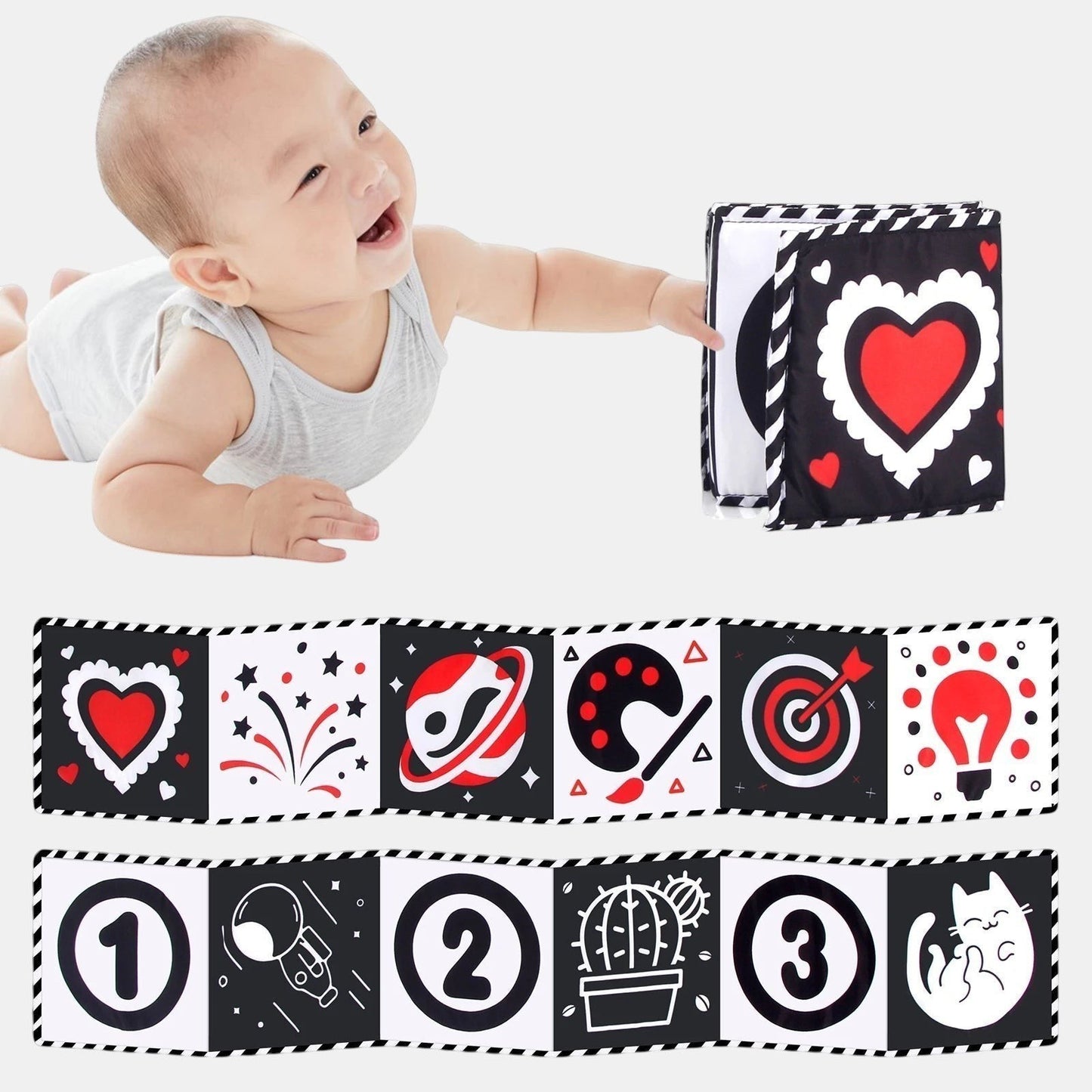 Livre sensoriel en tissu noir et blanc avec touches de rouge, motifs variés (cœur, fusées, chiffres, chat) pour bébé. Marque Petit Éveil Montessori.