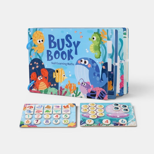 Livre sensoriel Montessori Petit Éveil Montessori sur le thème marin avec baleine, hippocampe, crabe et poissons. Idéal pour l'apprentissage des chiffres.