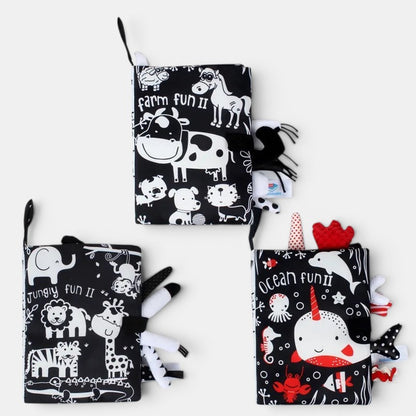Petit Éveil Montessori : 3 livres d'éveil en tissu noir et blanc avec des animaux de la ferme, de la jungle et de l'océan.