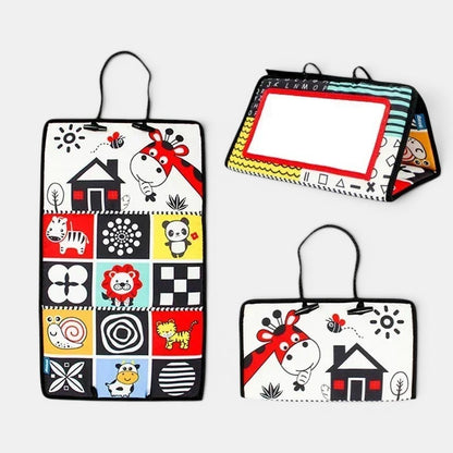 Petit Éveil Montessori Miroir sensoriel noir et blanc pour bébé avec motifs d'animaux et de maison.