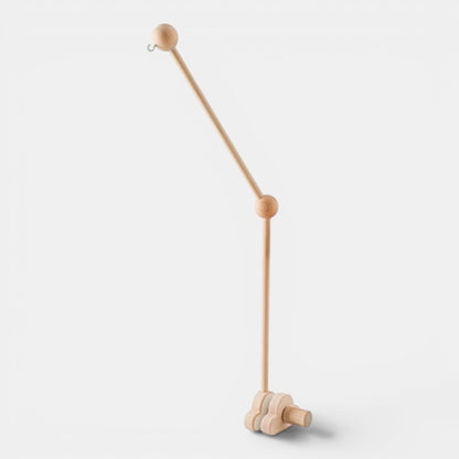 Petit Éveil Montessori mobile en bois naturel pour berceau, design minimaliste, idéal pour l'éveil sensoriel.