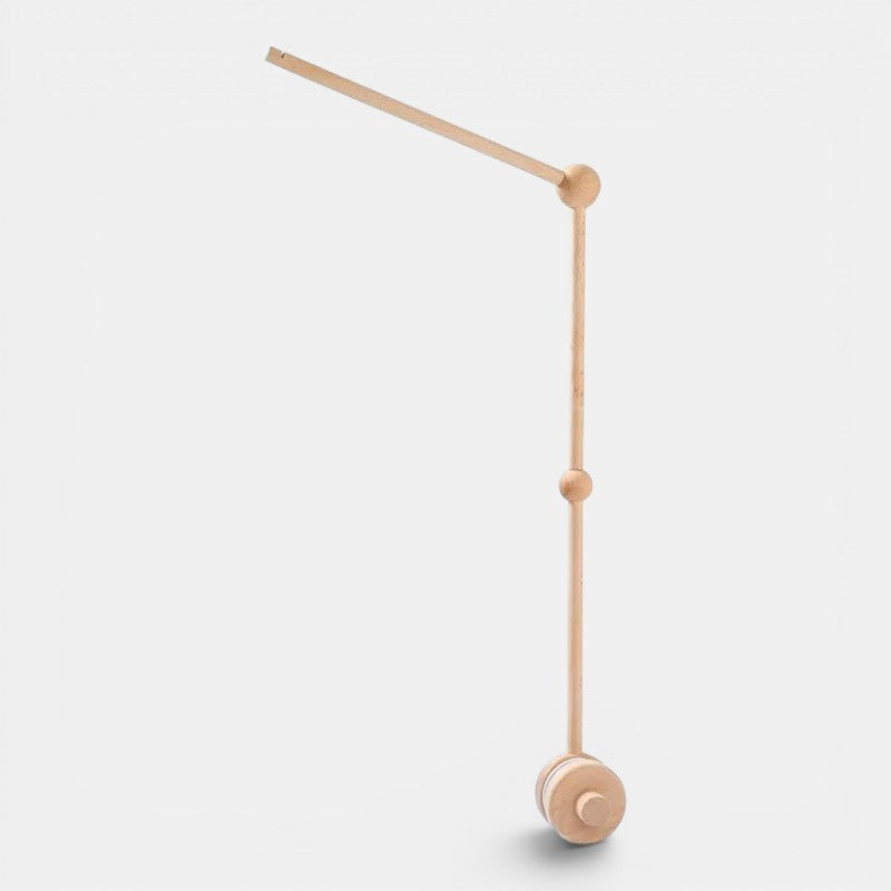 Petit Éveil Montessori mobile en bois naturel pour berceau, design minimaliste, idéal pour l'éveil sensoriel de bébé.