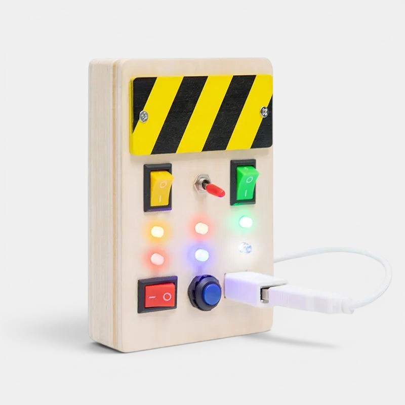 Planche occupée Petit Éveil Montessori en bois avec interrupteurs, lumières LED colorées et bouton, pour l'apprentissage des tout-petits.