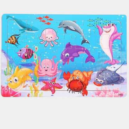 Puzzle Montessori 3D en bois Petit Éveil Montessori avec des animaux marins colorés : dauphin, requin, méduse, pieuvre, étoile de mer, crabe, raie.