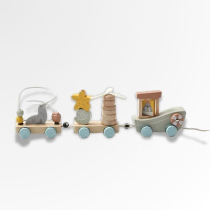 Petit Éveil Montessori train en bois avec phoque, étoile de mer et phare, idéal pour le développement de la motricité.