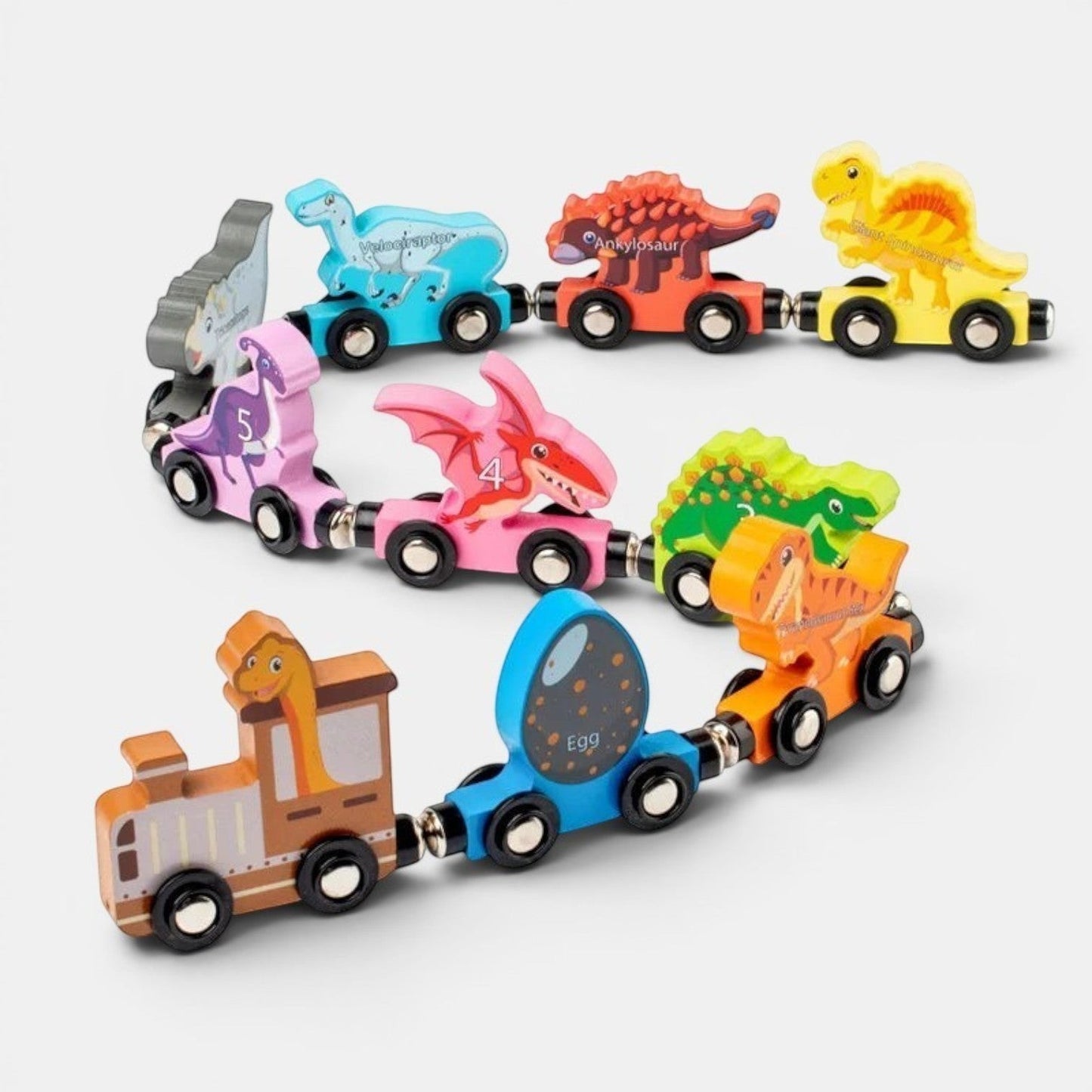 Petit Éveil Montessori Train magnétique en bois éducatif avec des dinosaures colorés et un wagon œuf.