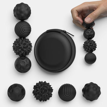 Petit Éveil Montessori balle sensorielle magnétique noire avec différentes textures pour la relaxation et la concentration.